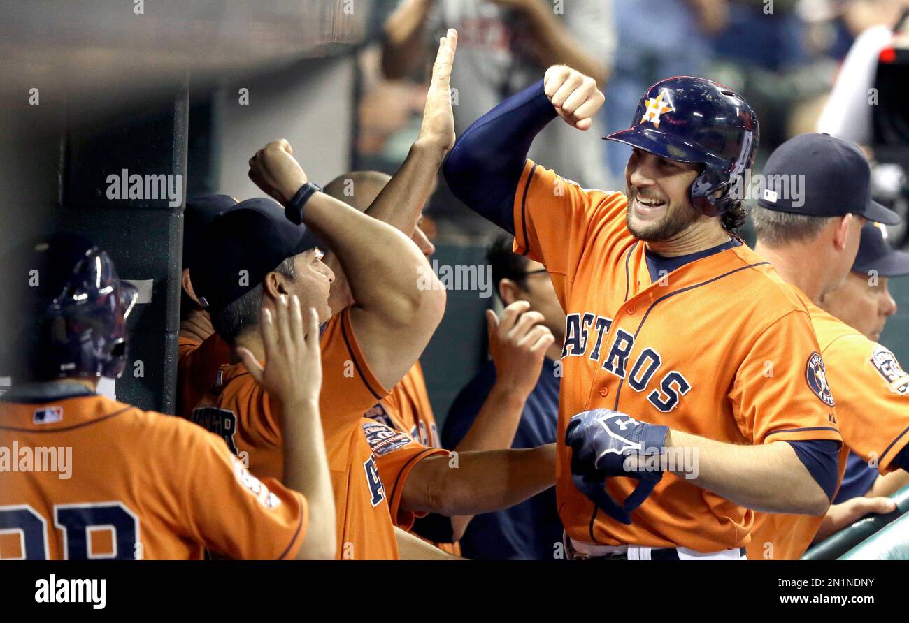 Houston Astros' Jake Marisnick, right, is congratulated in the dugout on  his two-run home run against the Los Angeles Dodgers during the second  inning of a baseball game Friday, Aug. 21, 2015