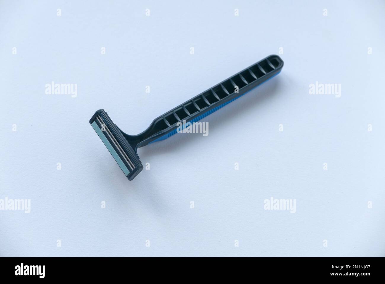 Disposable razor isolated on a white background. Stock Photo