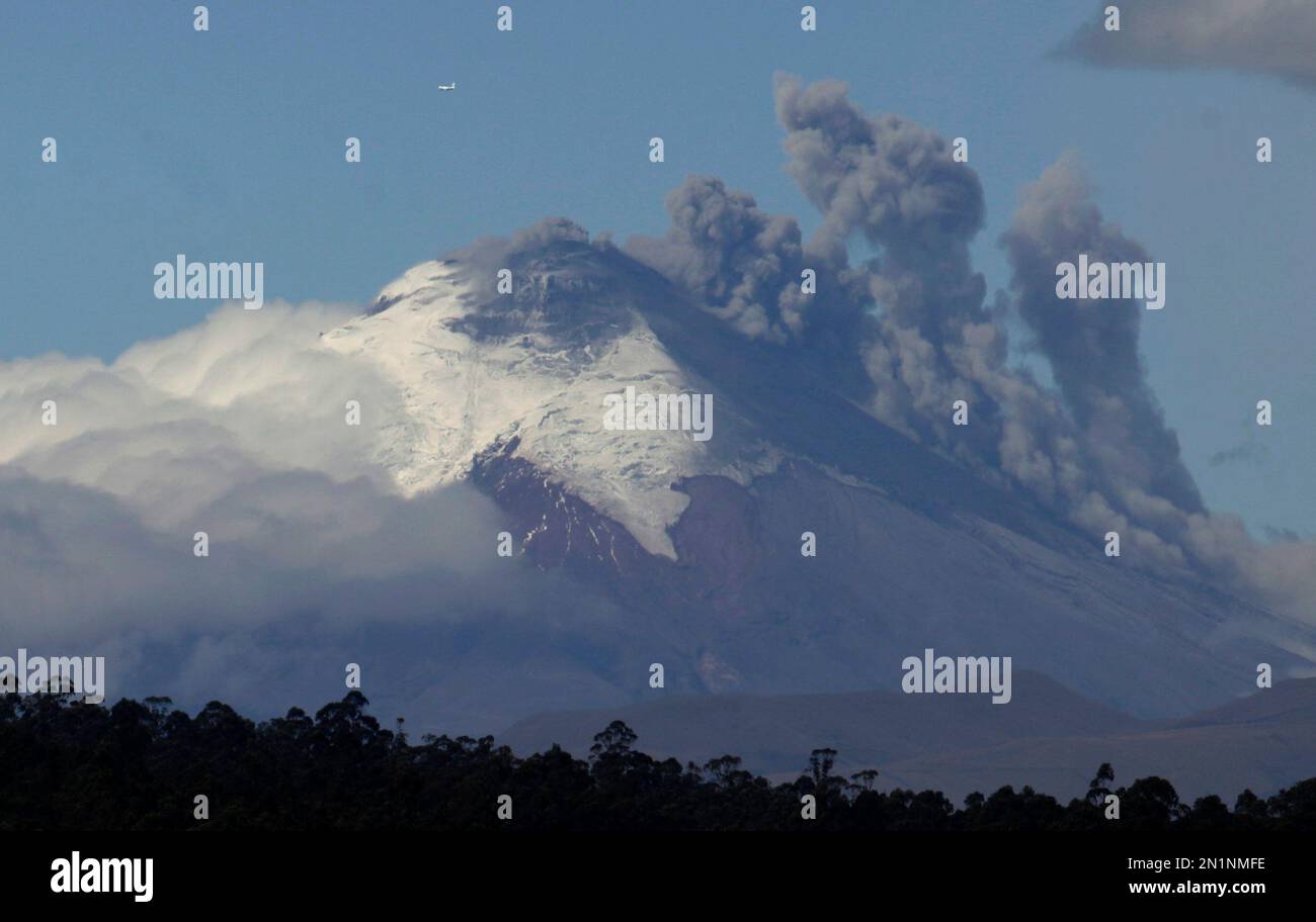 Plumes of smoke and ash billow from the Cotopaxi volcano as seen from