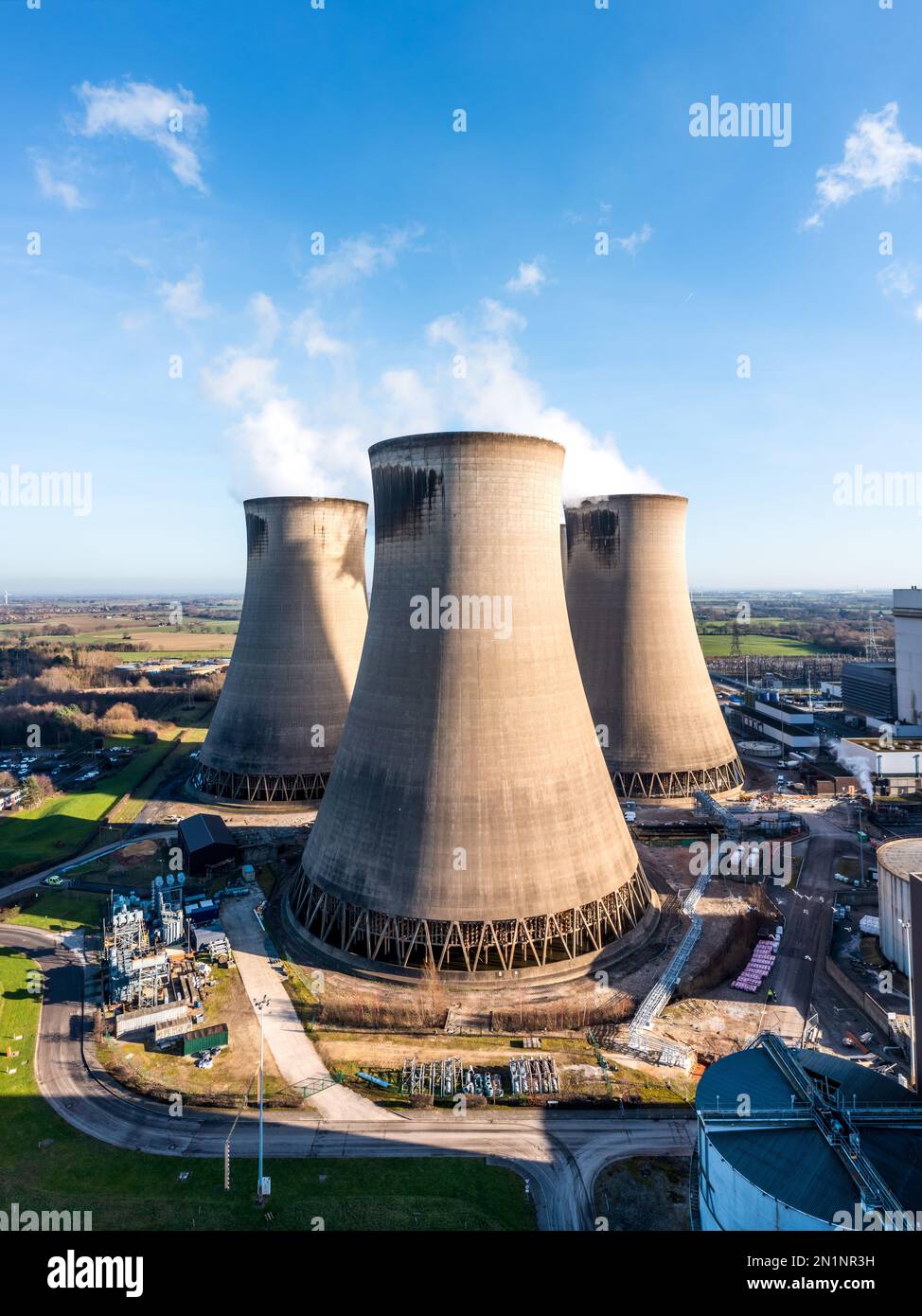 A vertical  aerial view of a group of cooling towers at a coal fired power station Stock Photo