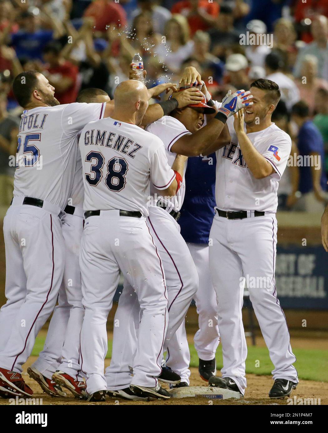 Former baseball player Adrian Beltre, left, greets former teammate Félix  Hernández after he was inducted into the Mariners Hall of Fame during a  ceremony before a baseball game between the Mariners and