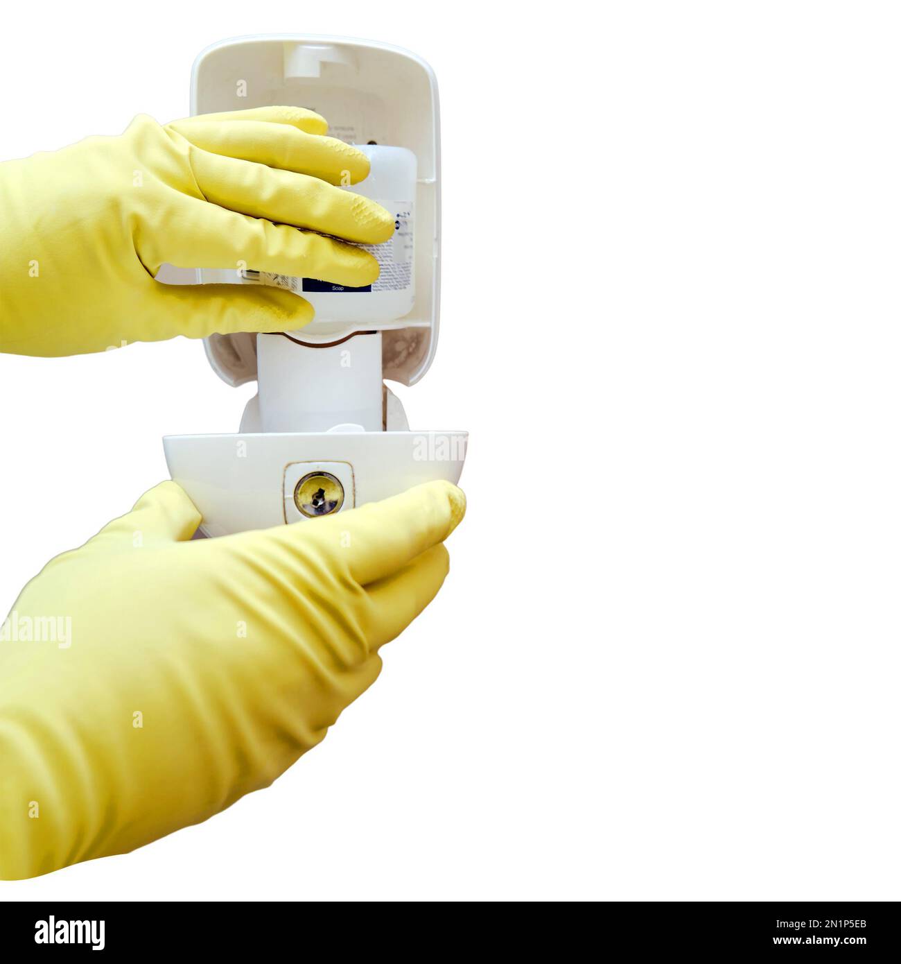 Replacing soap in a dispenser on the wall of a public toilet, isolated