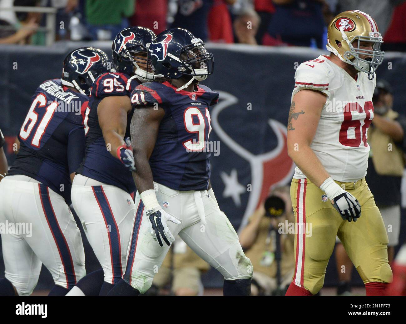 Houston Texans' Jason Ankrah (91) celebrates after he sacked San