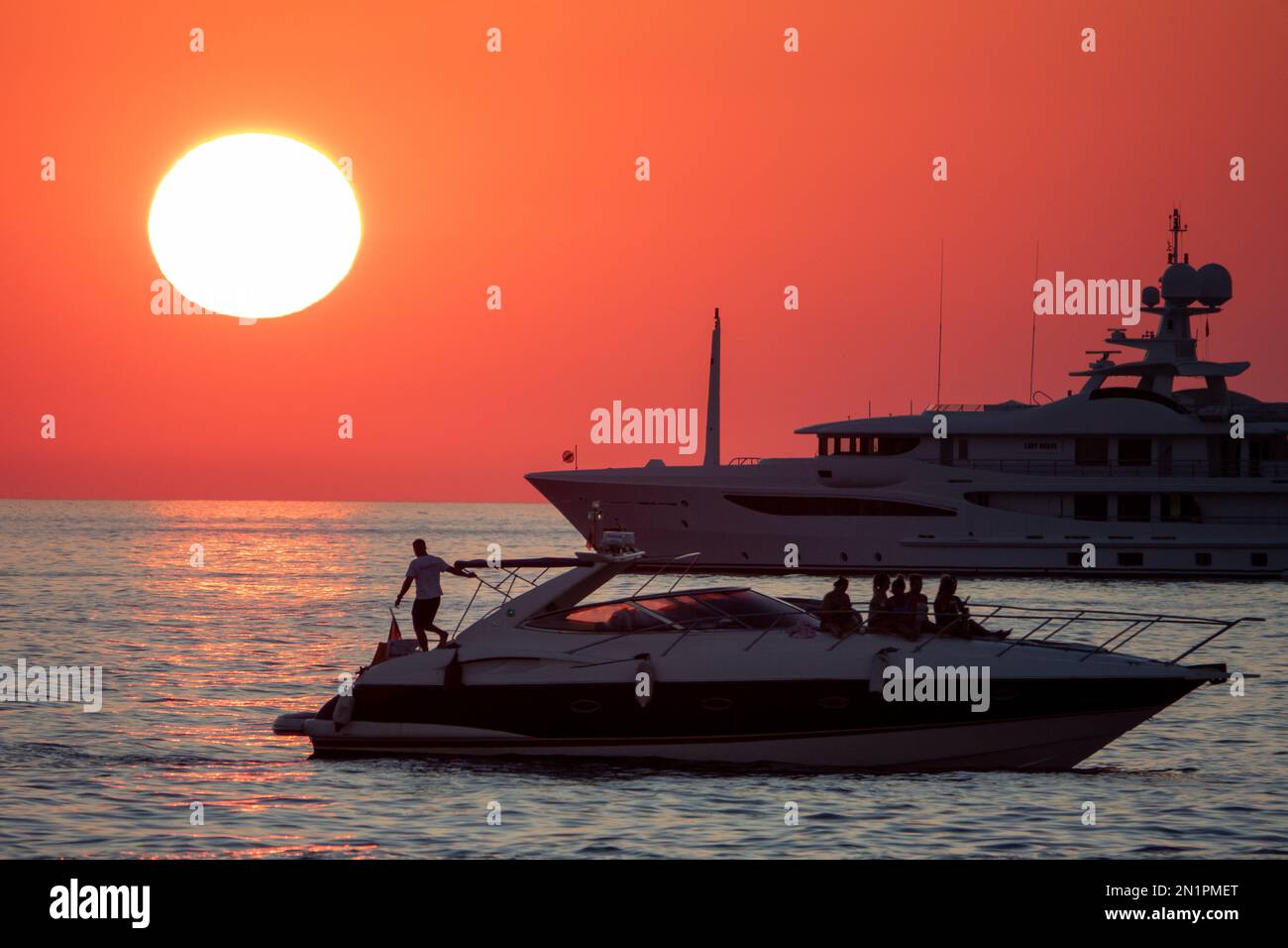 Standalone picture dated July 12th shows people watching the sunset in