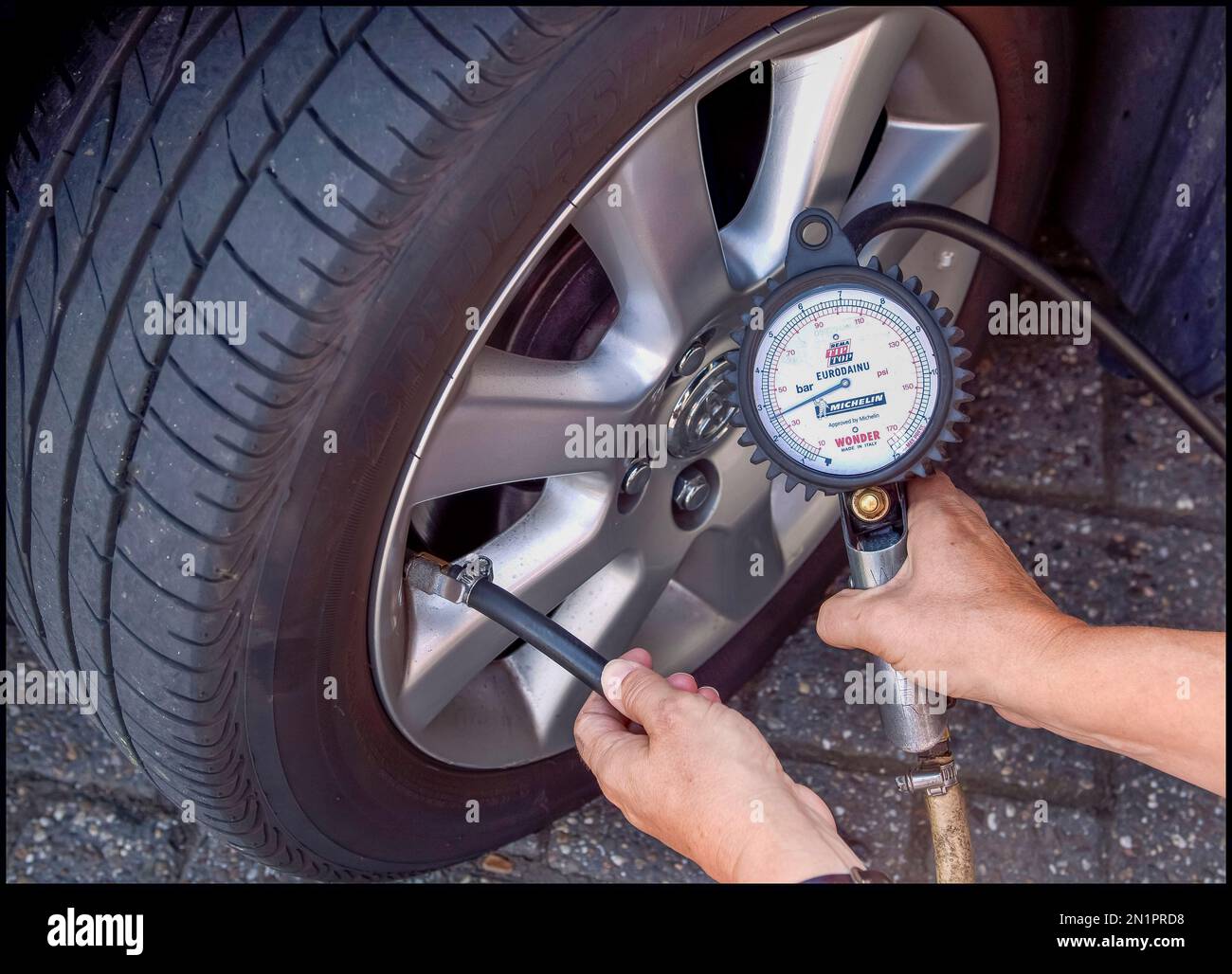 Pressure of a car tire is measured Stock Photo Alamy