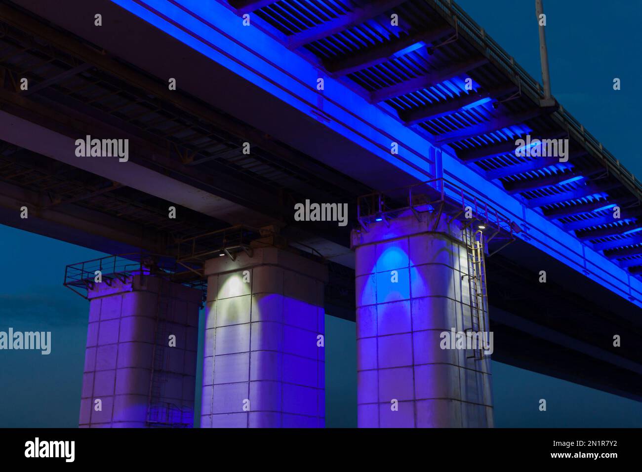 Illuminated New bridge at night. This bridge goes across the Ob in Barnaul, connecting the Central District of the city and the right bank of the rive Stock Photo