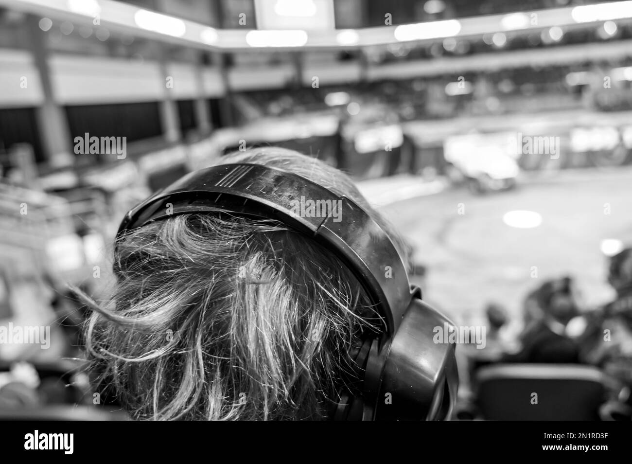 Selective focus on spectators in the stands with hearing protection