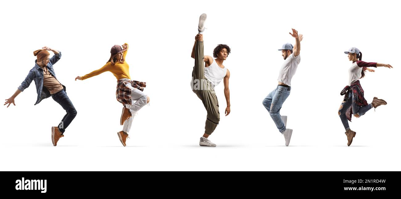 Group of young male and female dancers performing street dance isolated on white background