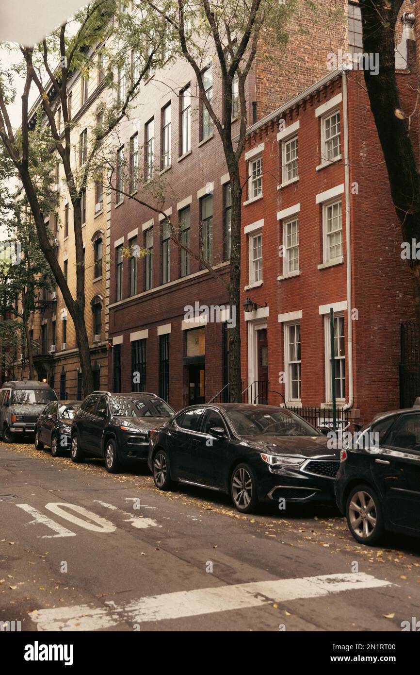 Cars and brick houses on street in New York City,stock image Stock ...