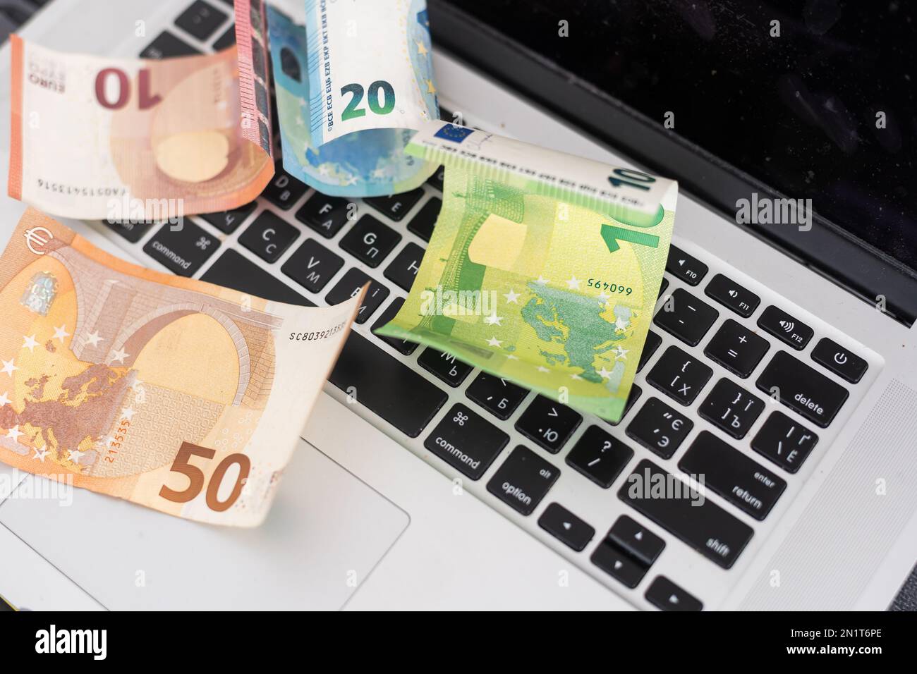100 dollar bills on keyboard hi-res stock photography and images - Alamy