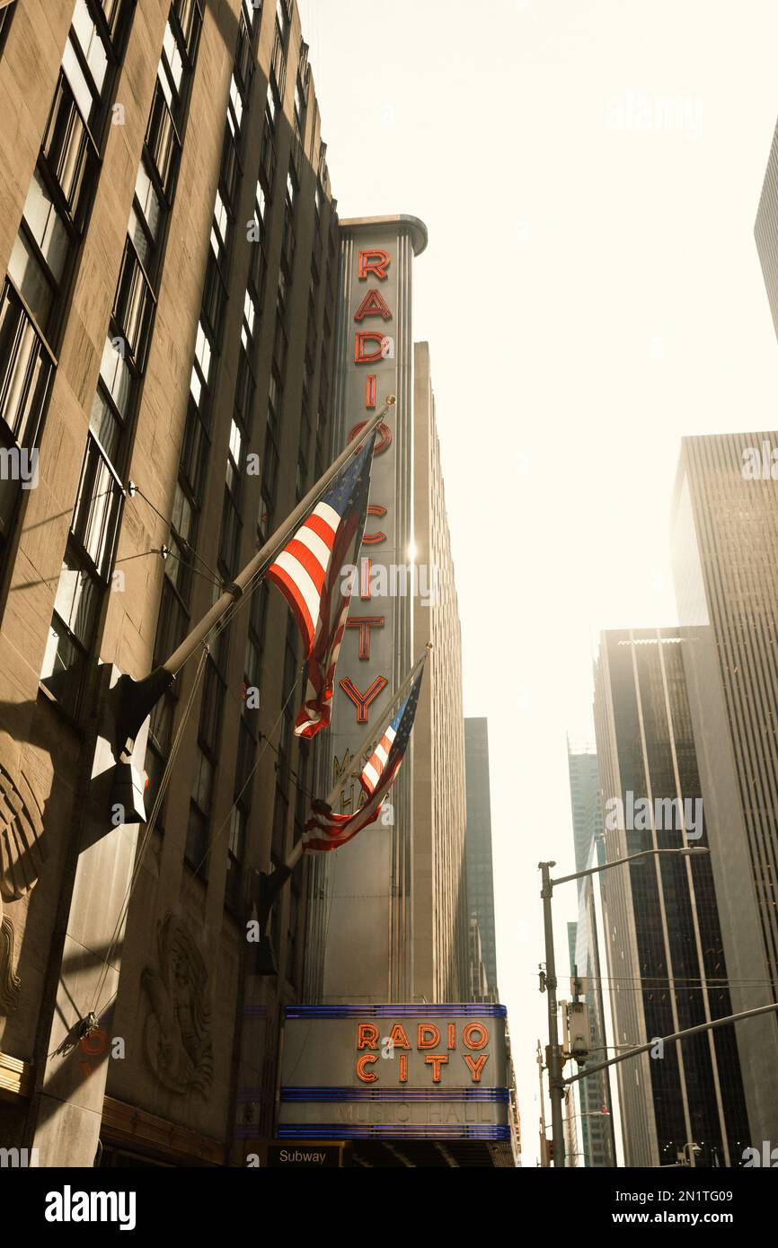 NEW YORK, USA - OCTOBER 13, 2022: usa flags on Radio City music hall building in Manhattan Stock Photo