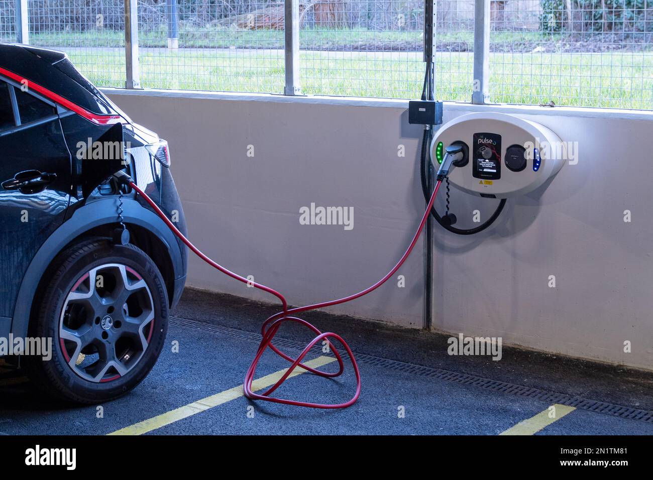 Maidenhead, Berkshire, UK. 6th February, 2023. Electric car charging points and cars charging in a car park in Maidenhead, Berkshire. It has been announced today that following the collapse of battery manufacturing company Britishvolt into adminstration, that they are to be taken over by an Australian company, Recharge Industries. Credit: Maureen McLean/Alamy Live News Stock Photo