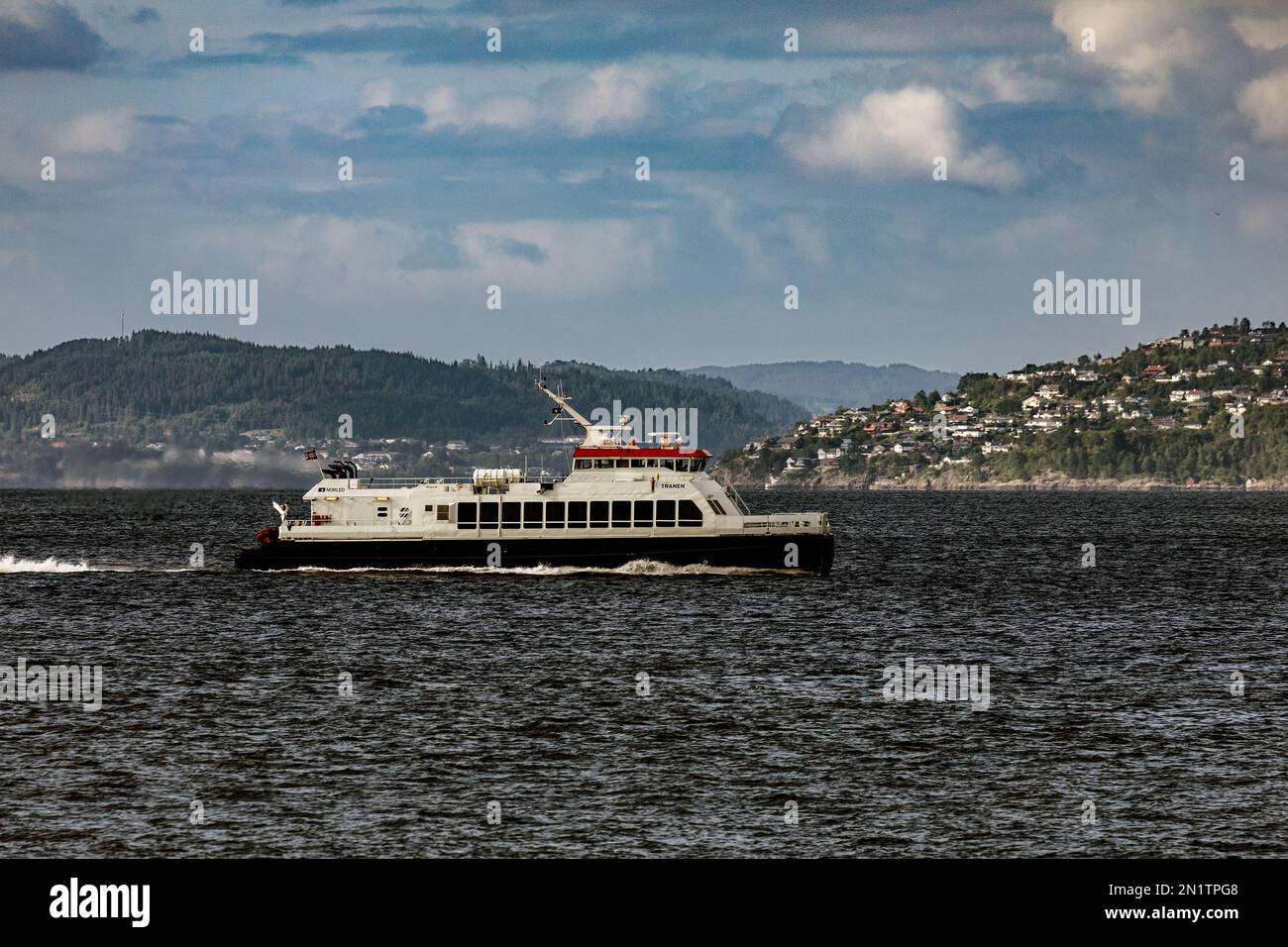 High speed passenger catamaran Tranenn arriving the port of Bergen, Norway. Stock Photo
