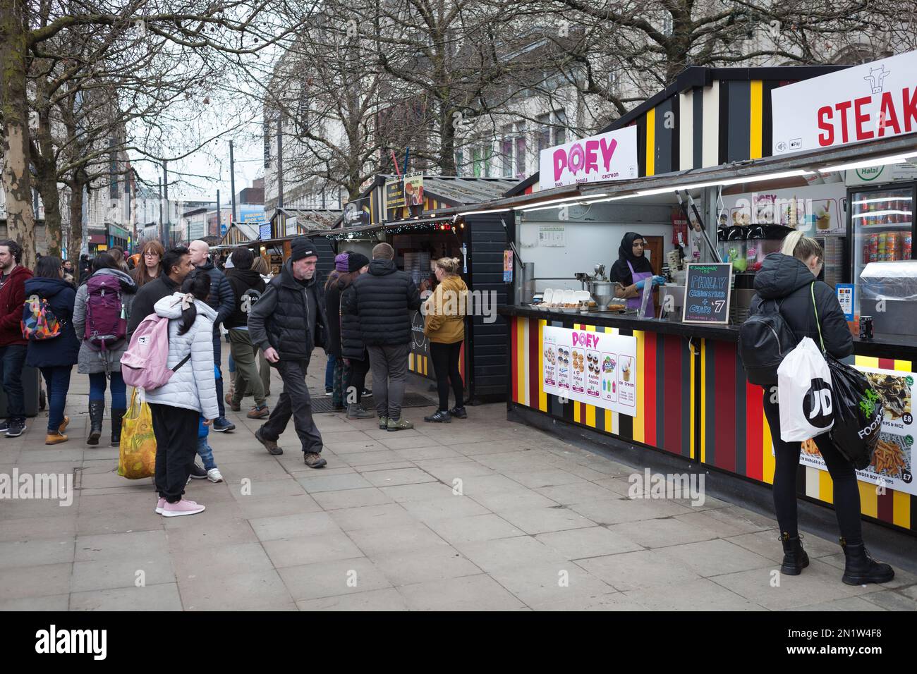 People gathering at the Piccadilly Streetfood Bars in Piccadilly