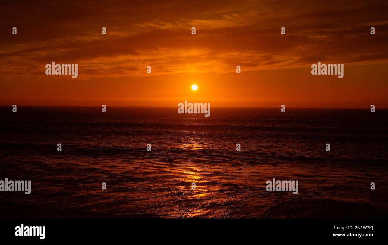 A beautiful bright orange sunset sky over the Playas de Rosarito ...