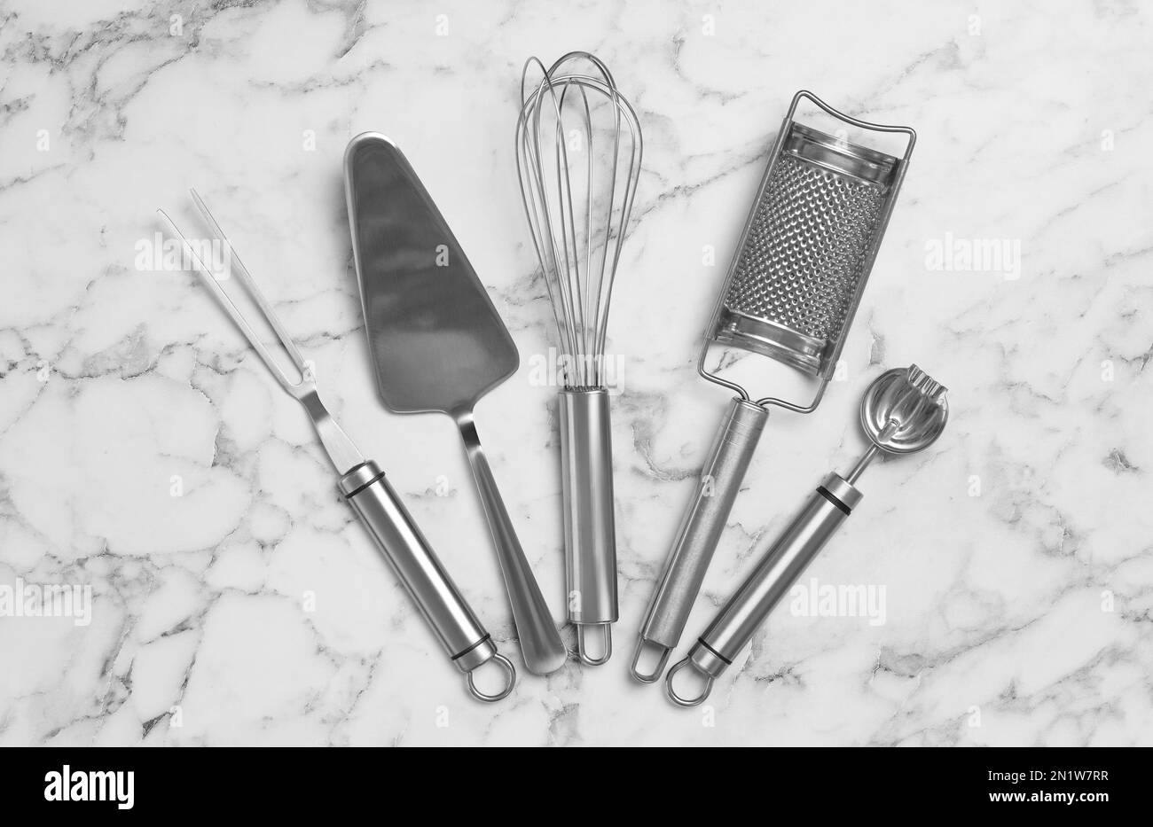 Cooking utensils on white marble table, flat lay Stock Photo