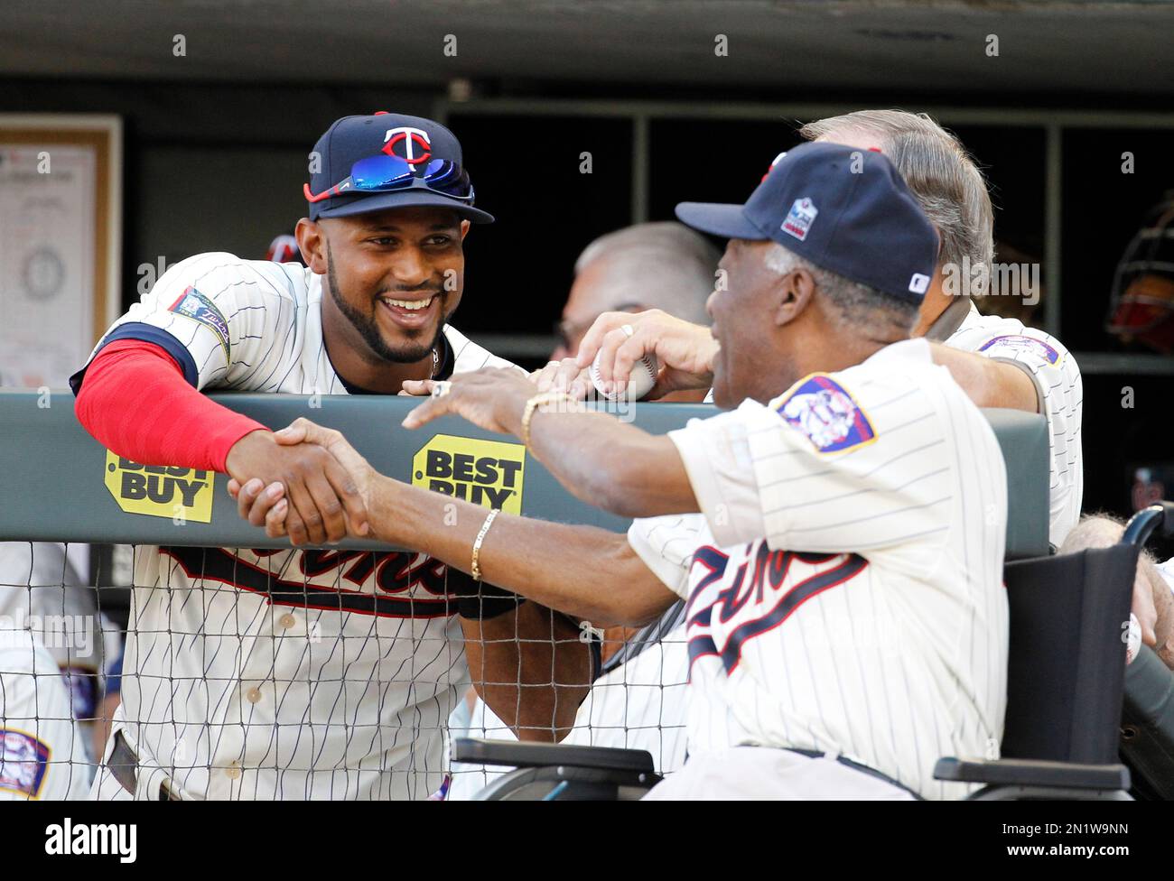 Minnesota Twins center fielder Aaron Hicks, left greets former