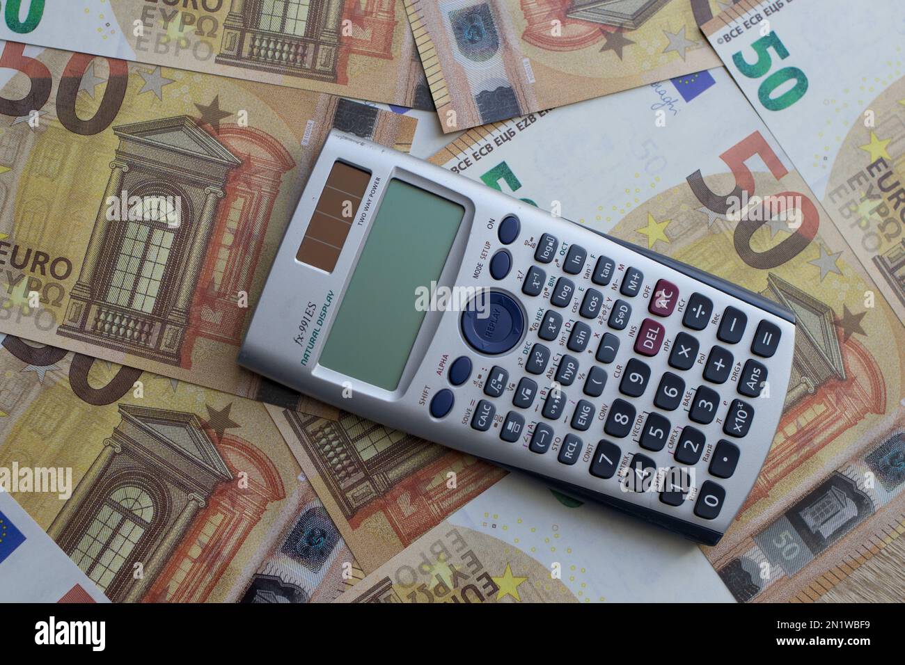 calculator lies on 50 euro banknotes Stock Photo