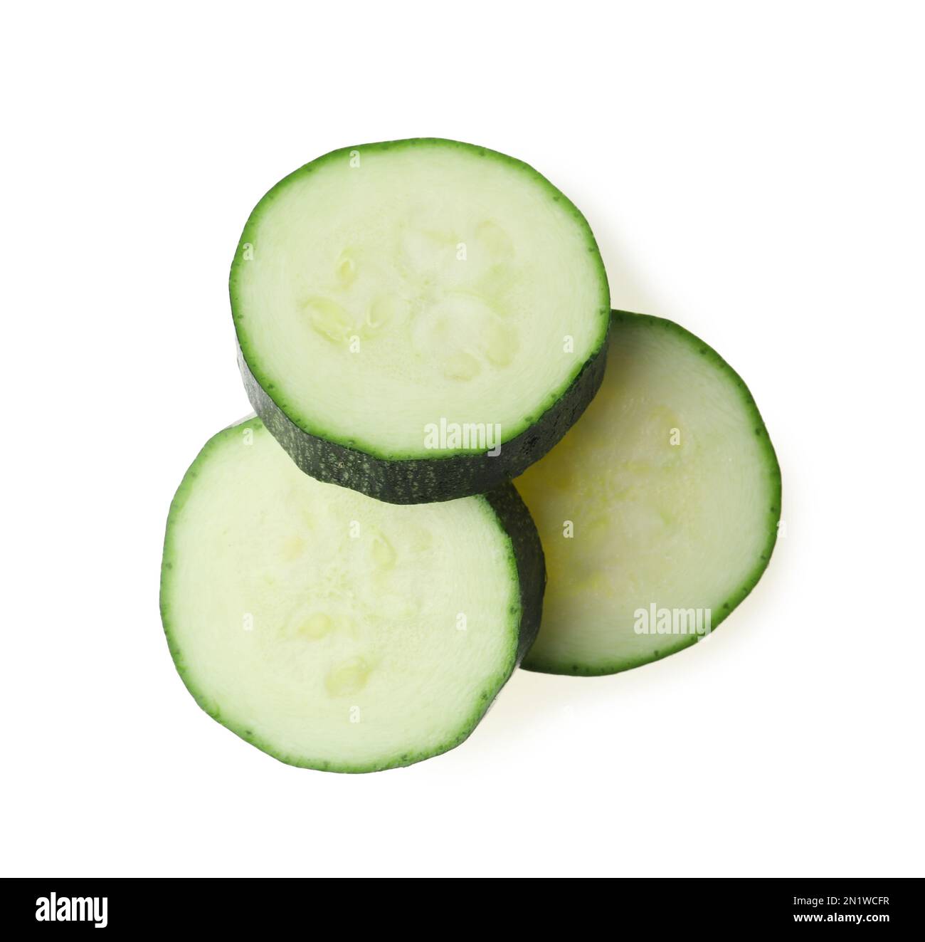 Slices of ripe zucchini on white background, top view Stock Photo