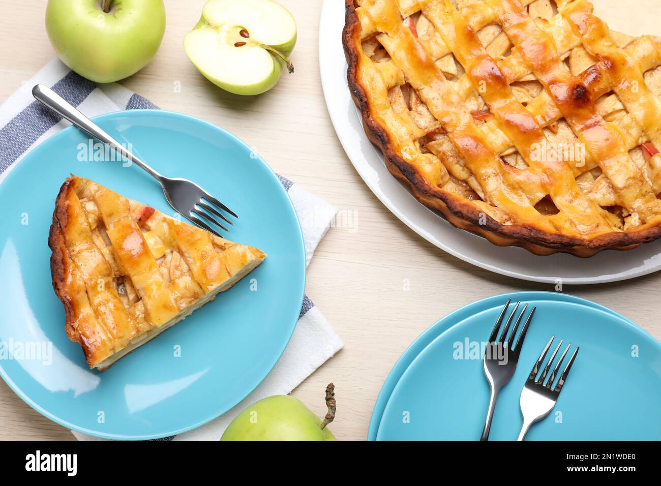 Traditional apple pie and fresh fruits on wooden table, flat lay Stock Photo