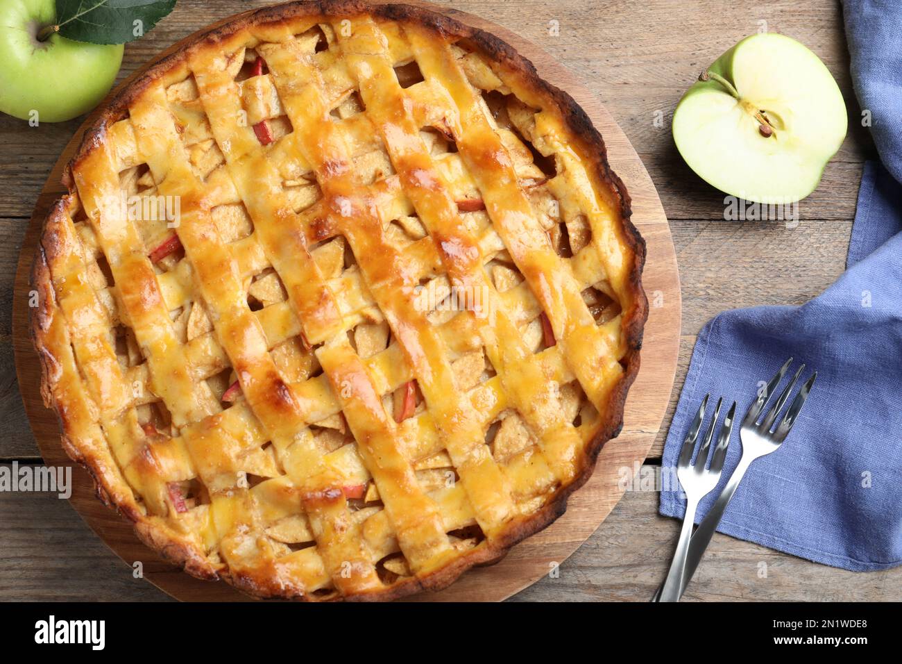 Flat lay composition with fresh traditional apple pie on wooden table Stock Photo