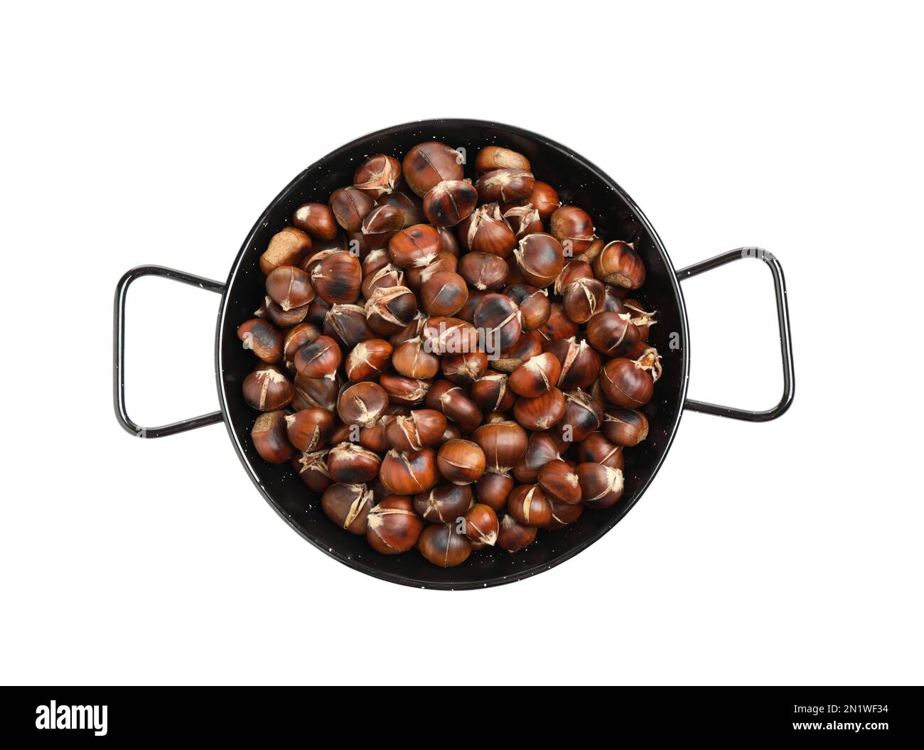 Delicious roasted edible chestnuts in wok frying pan isolated on white