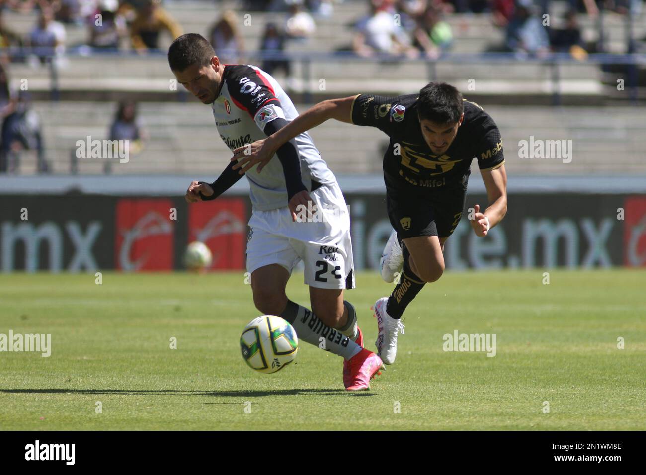 February 5, 2023 in Mexico City, Mexico: Gustavo Del Prete of Pumas and  Hugo Nervo of Atlas fight for the ball during the Pumas vs Atlas football  match of the closing tournament