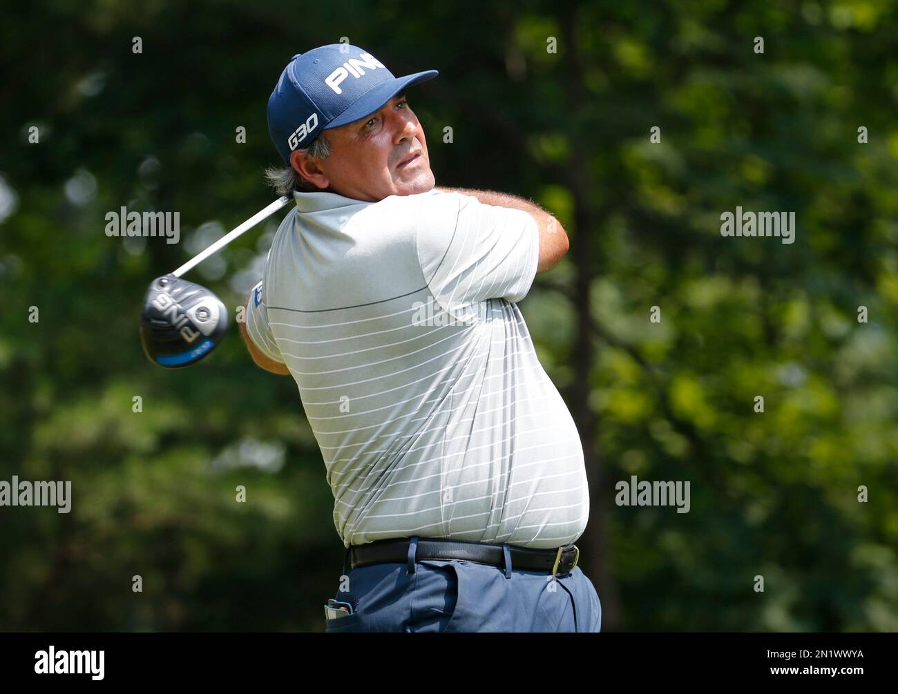 Angel Cabrera, of Argentina, watches his tee shot on the 15th hole