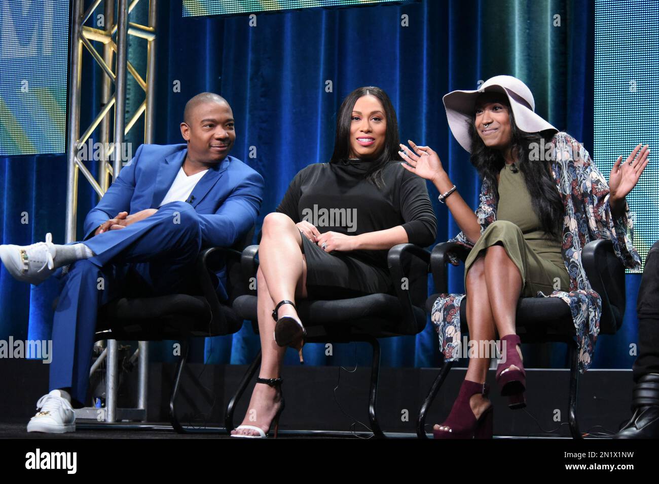 Ja Rule, from left, Aisha Atkins, and Brittney Atkins speak onstage