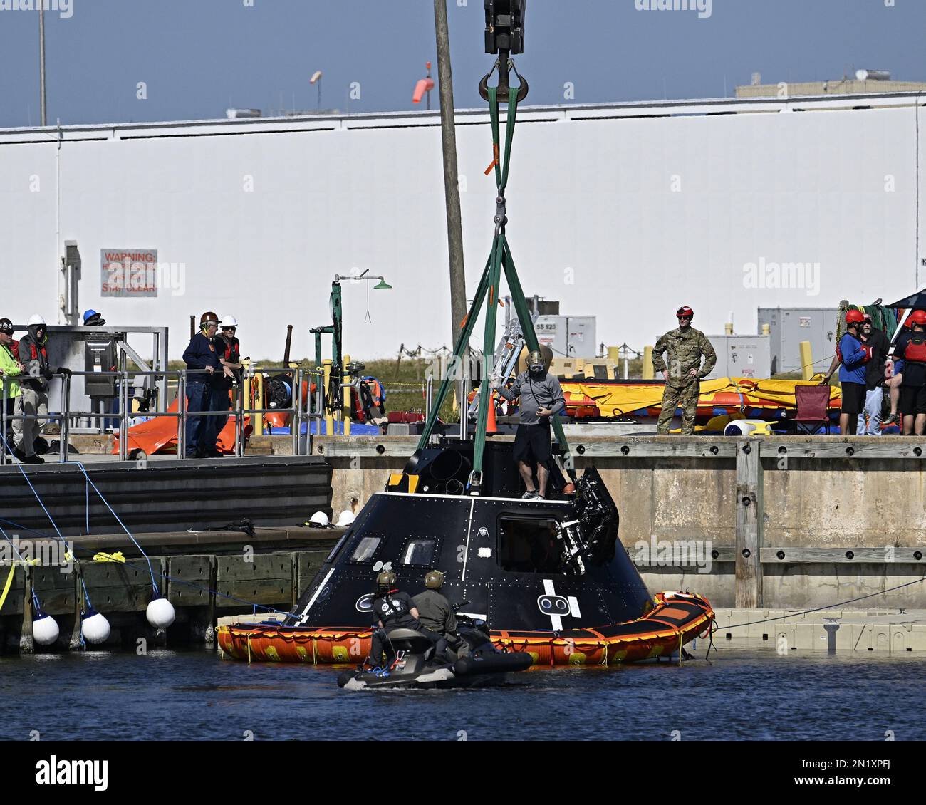 A mock up of the Orion spacecraft is prepared to be hoisted by a crane following the NASA and Department of Defense training session in the Turning Basin at the Kennedy Space Center, Florida on Monday, February 6, 2023. Photo by Joe Marino/UPI Credit: UPI/Alamy Live News Stock Photo