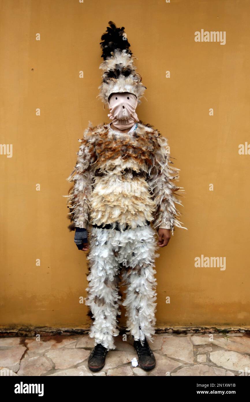 Alfredo Ortega poses for a photo in his bird-feather suit after attending a  Mass commemorating the feast day of St. Francis Solano, in Emboscada,  Paraguay, Friday, July 24, 2015. Paraguayan Catholics honored