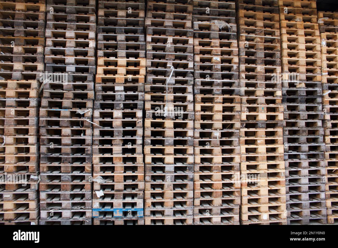 wall of stackes euro pallets outside Stock Photo