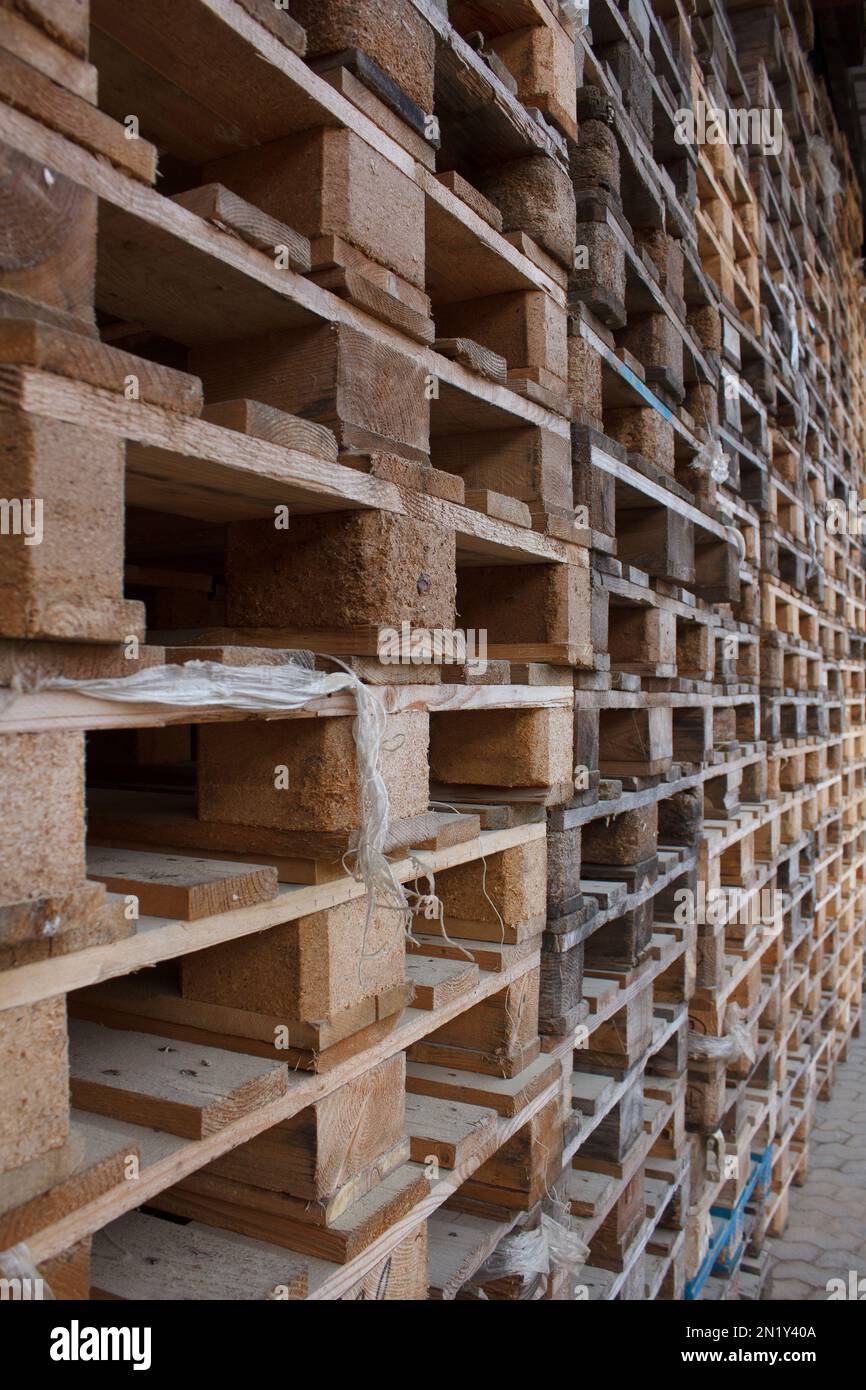 wall of stackes euro pallets outside Stock Photo