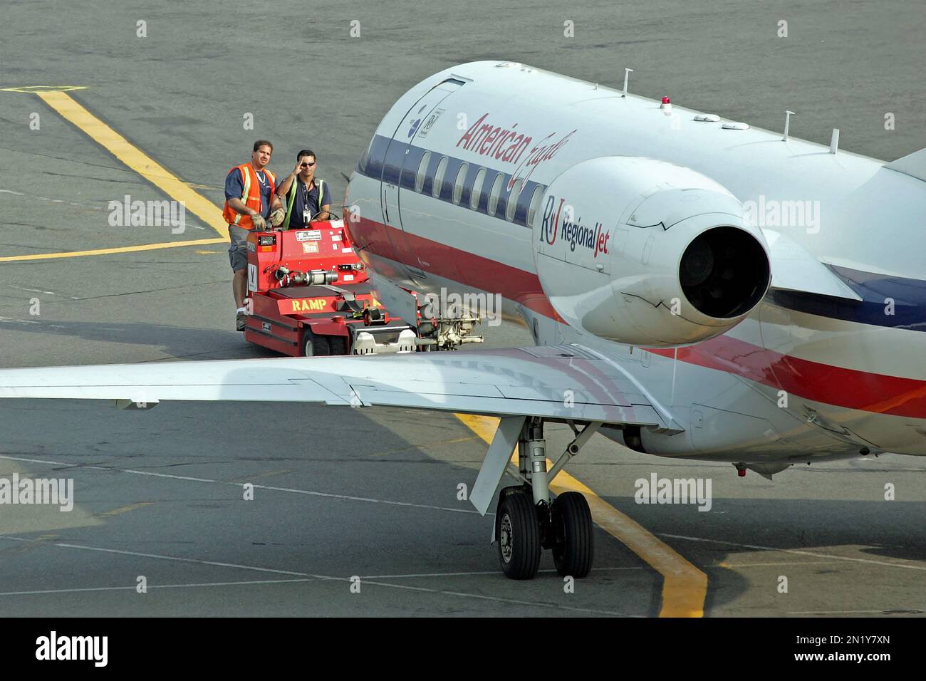Ground Crew signals American Eagle planes pilot ready to go Stock Photo
