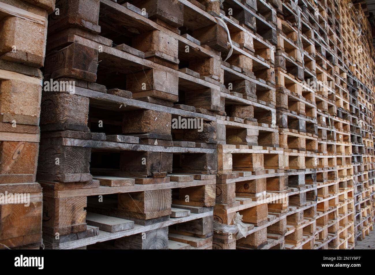 wall of stackes euro pallets outside Stock Photo