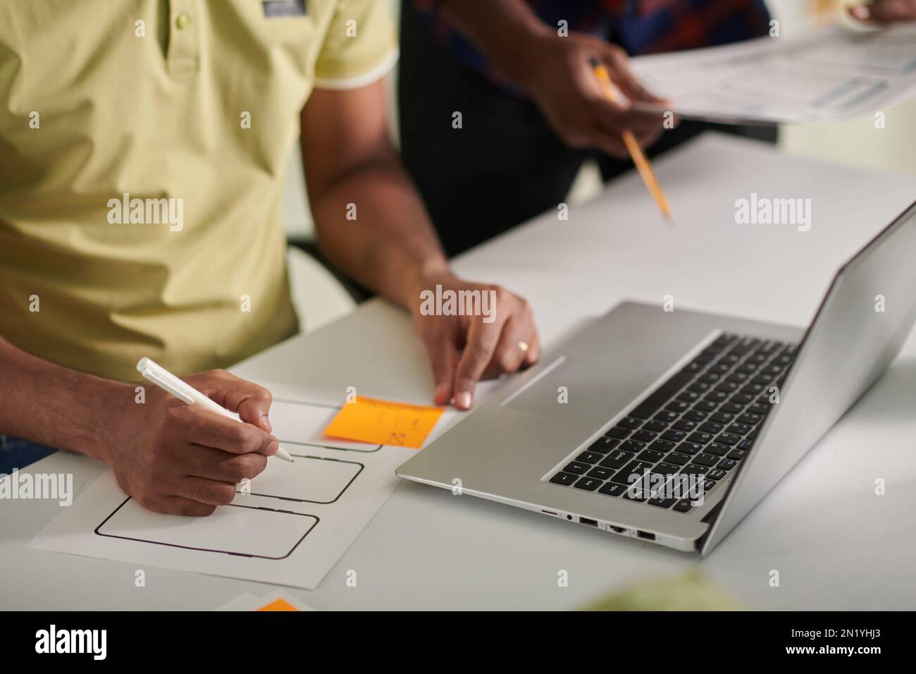 UX designer creating wireframe for new mobile application Stock Photo