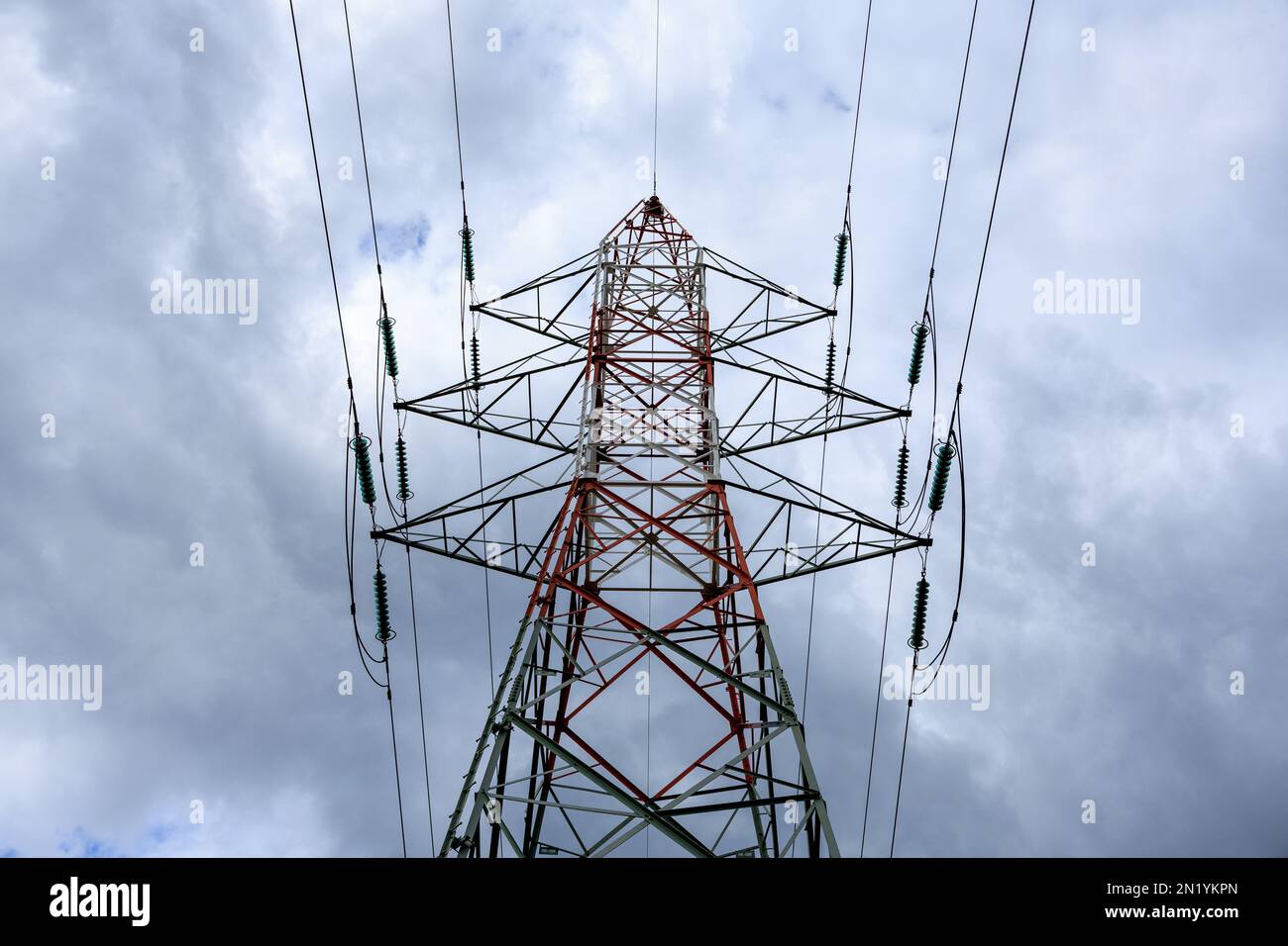 Pylons for electricity with a cloudy sky Stock Photo - Alamy
