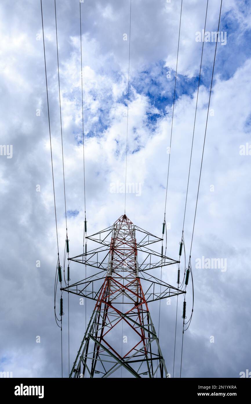 Pylons for electricity with a cloudy sky Stock Photo - Alamy