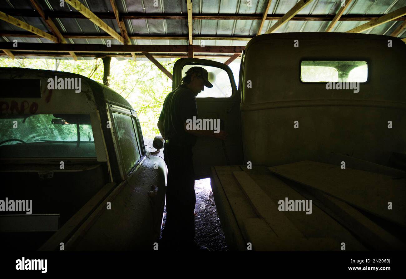 Maintenance man Rockey Bryson looks at a 1946 Ford truck used in the