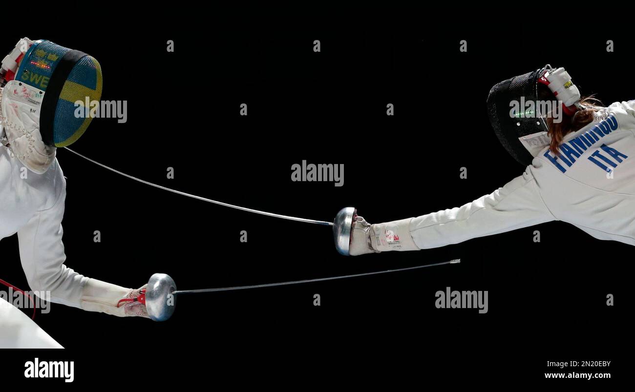 Rossella Fiamingo of Italy, right, touches Emma Samuelsson of Sweden