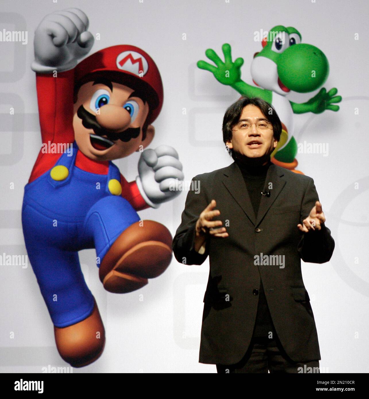 Nintendo President Satoru Iwata speaks as he unveils a Nintendo