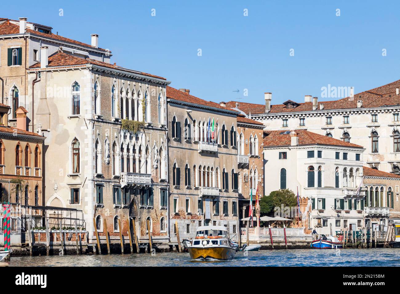 Palazzi lining Canal Grande with alilaguna airport transfer boat, Grand Canal, Venice, Veneto, Italy, Europe Stock Photo