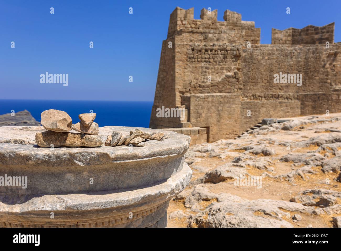 Panoramic view of ruins of ancient city of Lindos on colorful island of ...