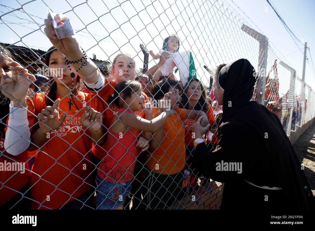 Female inmates, some with their children, watch Pope Francis leave 