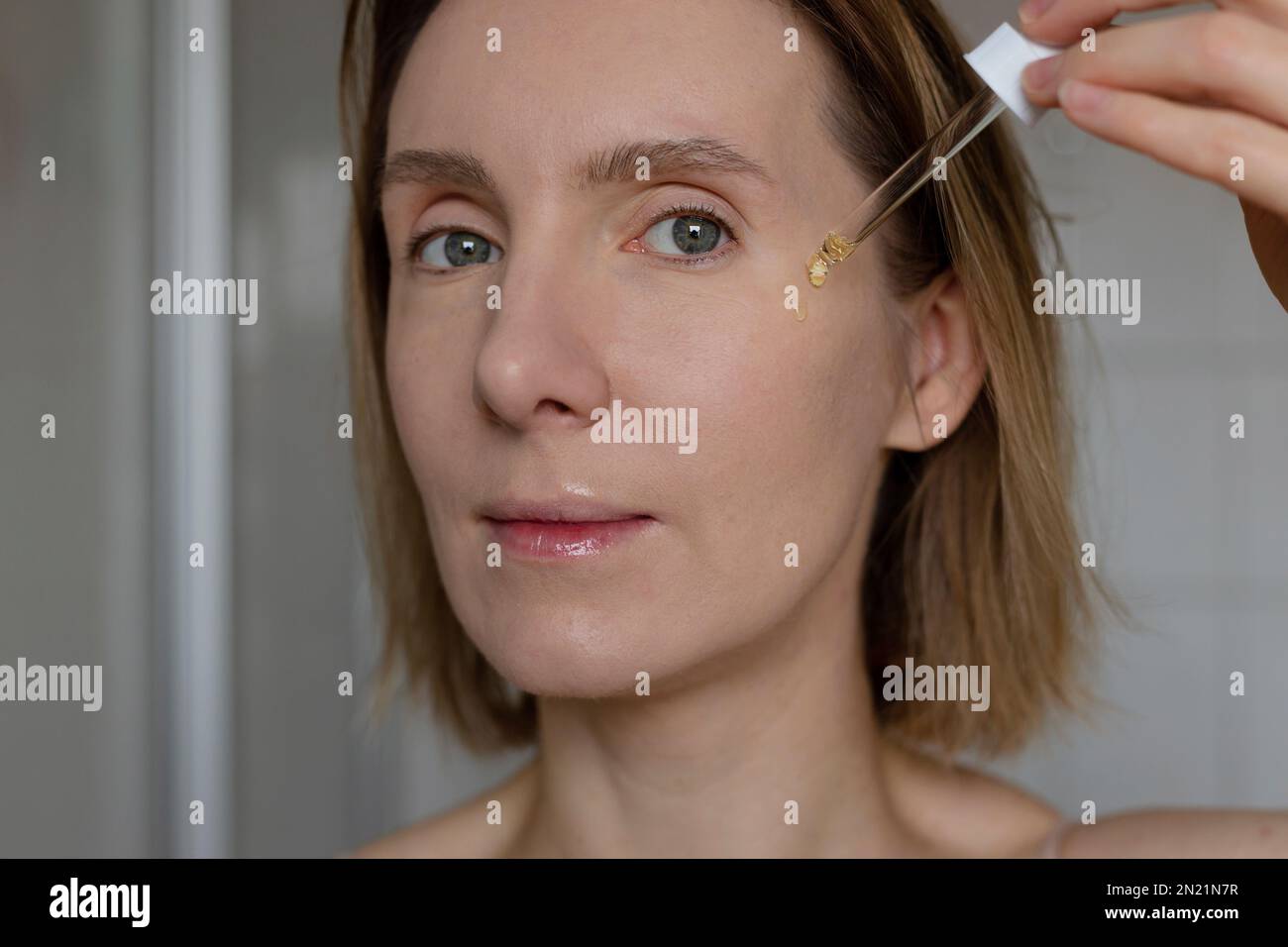 Woman face serum close up hi-res stock photography and images - Alamy