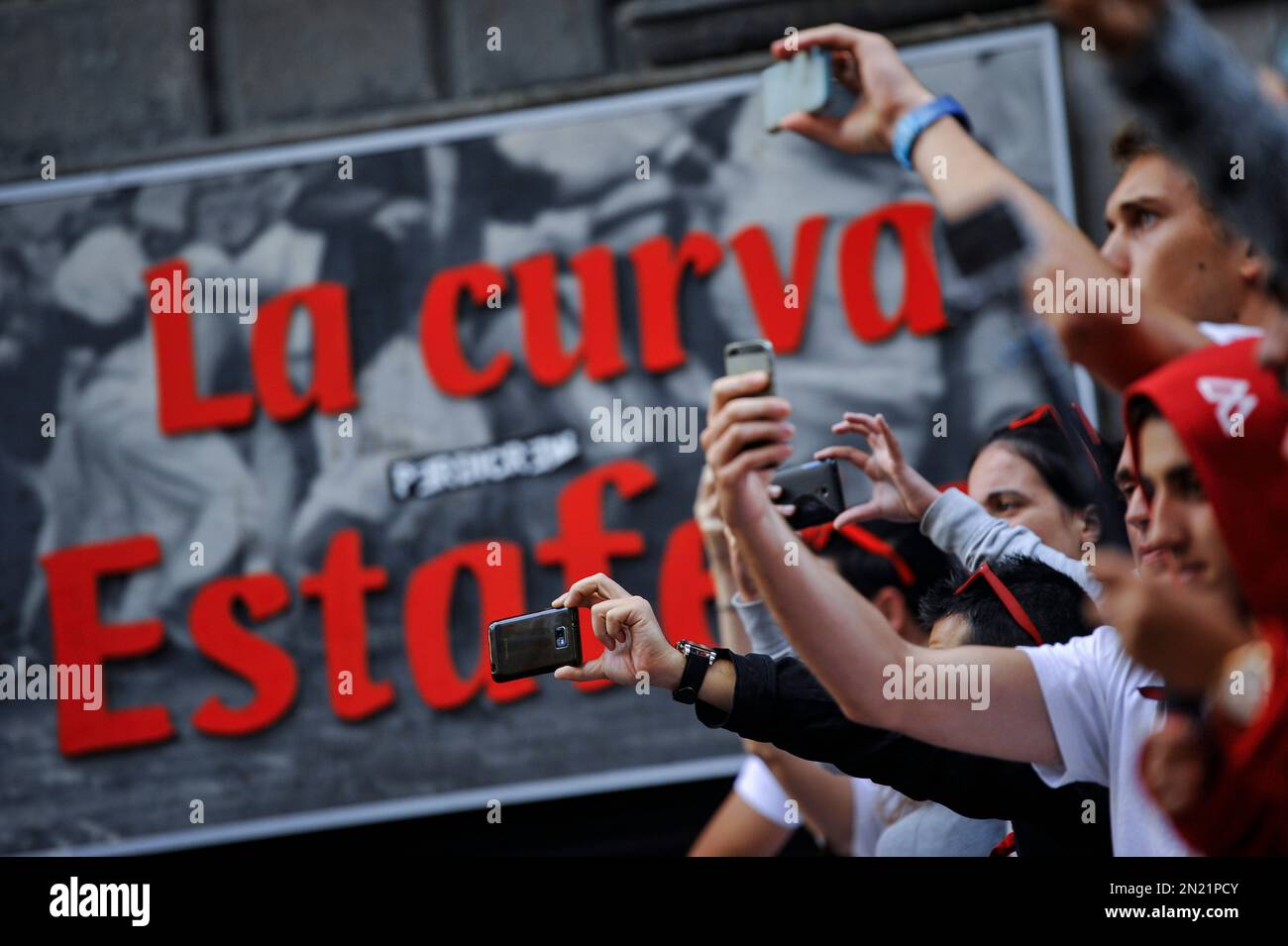 People take photos in front the cartel announcing Estafeta Corner ...
