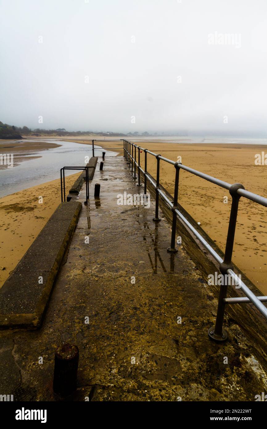 hand rails leading to a beach. Abersoch, Llanengan in Gwynedd, Wales, UK, portrait Stock Photo