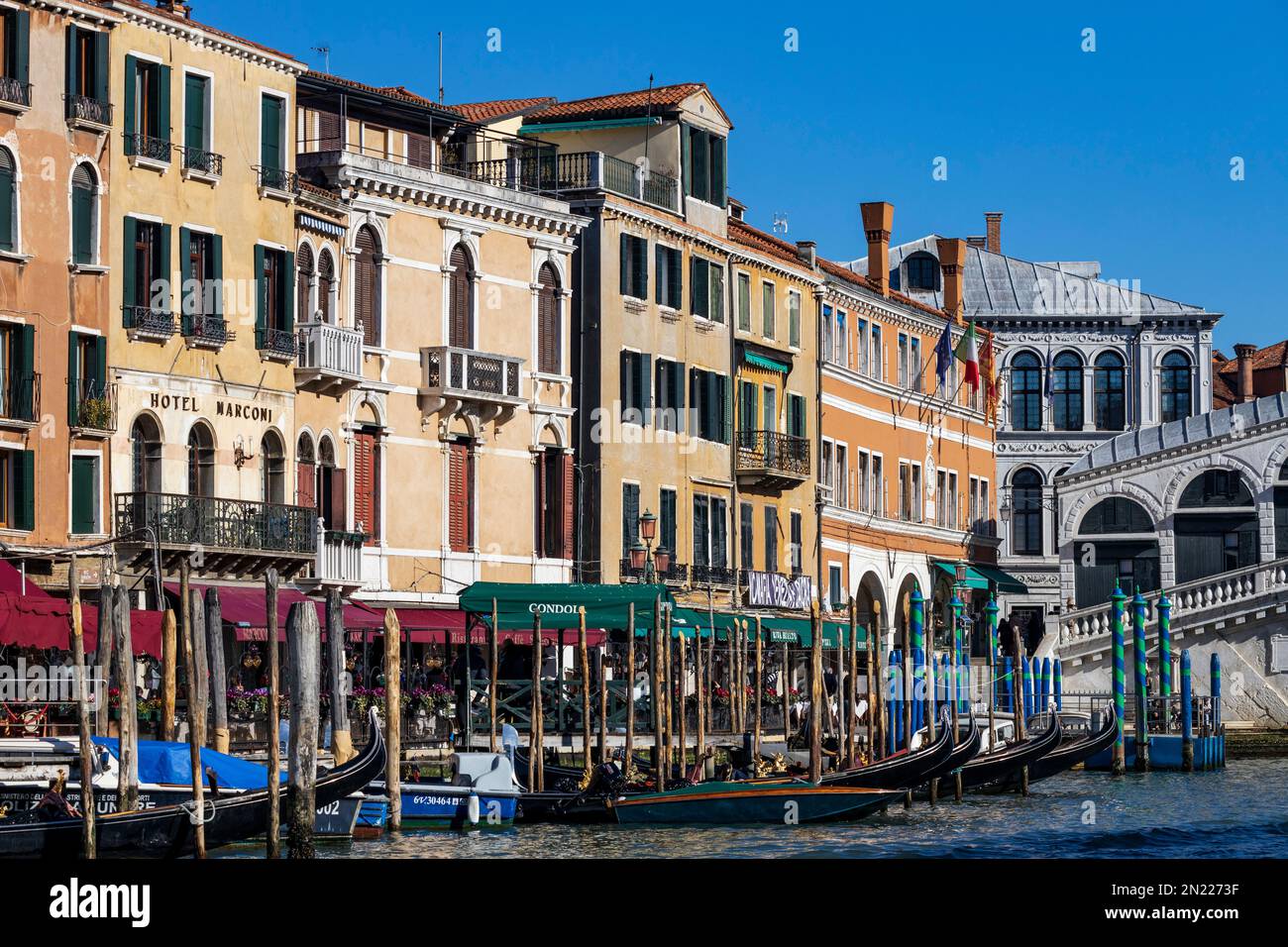 Gondolas and waterfront with hotels near Rialto Bridge, Canal Grande, Grand Canal, Venice, Veneto, Italy, Europe Stock Photo