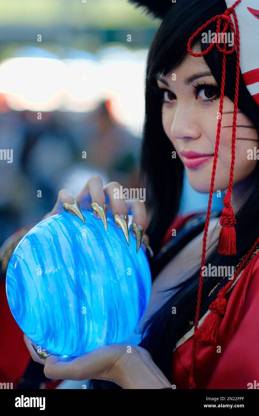 An Anime fan in costume poses for a photo at the 24th annual Anime Expo ...