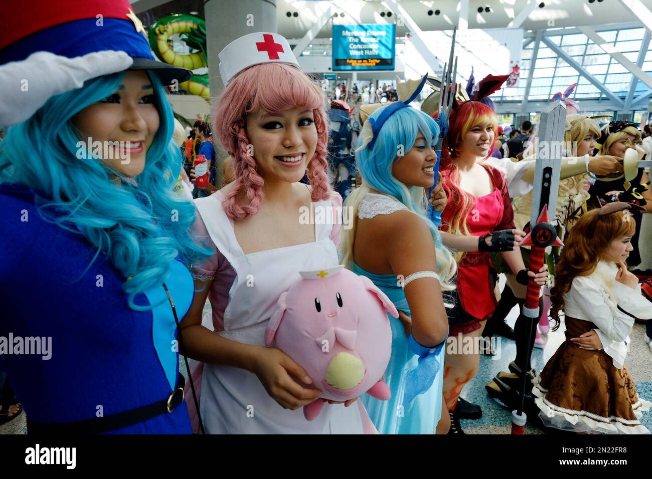 Anime fans in costumes pose for photos at the 24th annual Anime Expo ...